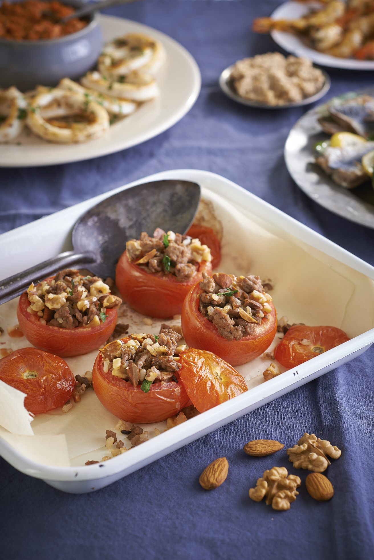 Tomatoes stuffed with nuts, lamb and brown rice -